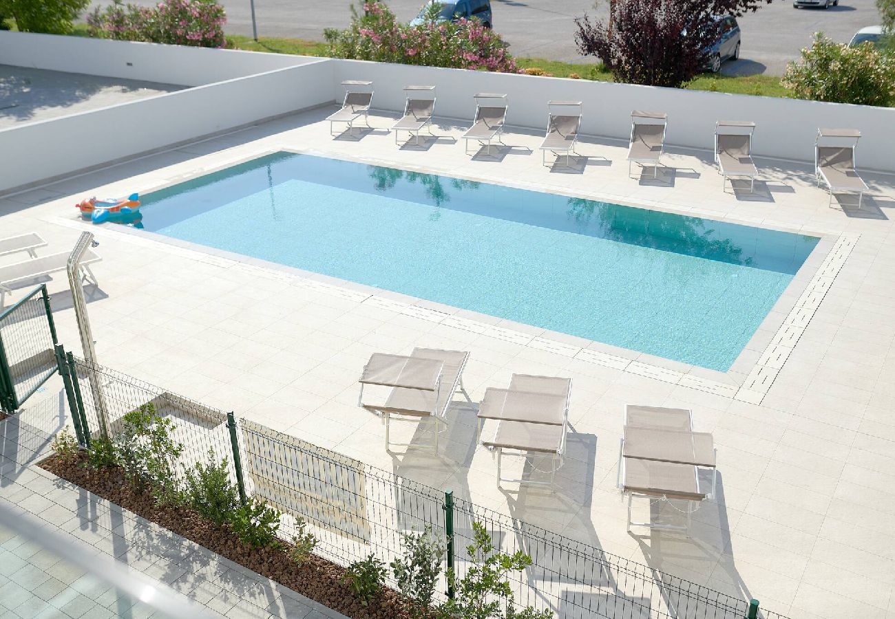 Ferienwohnung in Jesolo - West Village Appartamento - NUOVO con piscina 